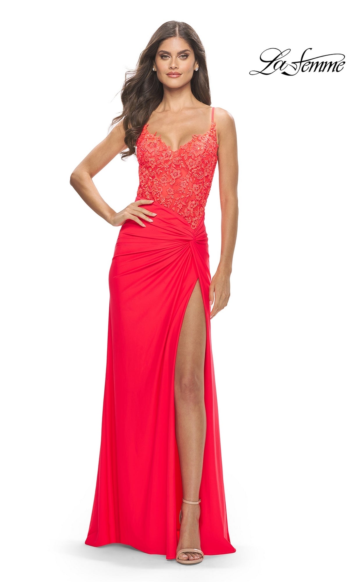 A woman models the Sheer-Bodice Long Prom Dress: La Femme 31447, a bright red sleeveless gown with an embroidered bodice, high slit skirt, and ruched waist detail. She pairs it with strappy heels. The La Femme logo is at the top right.