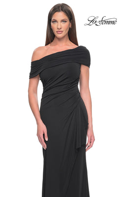 A woman wears a black, floor-length off-the-shoulder Long Formal Dress: La Femme 31459 with side-ruched detailing.
