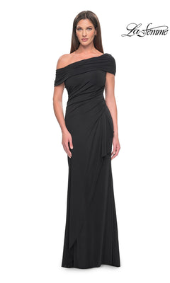 A woman wears a black, floor-length off-the-shoulder Long Formal Dress: La Femme 31459, featuring a draped, wrap-style skirt.
