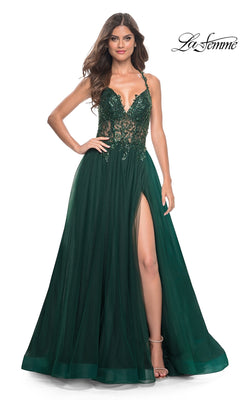 A woman models the La Femme Beaded-Bodice Long A-Line Prom Gown 31471, featuring a sleeveless dark green design with a lace bodice, deep V-neckline, and high slit against a plain background.