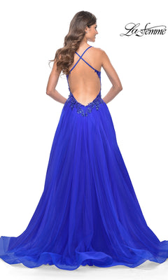 A woman with long wavy hair wears the La Femme Beaded-Bodice Long A-Line Prom Gown 31471, a royal blue formal dress with a low back, crisscross straps, and beaded waist embellishments for an elegant designer look.