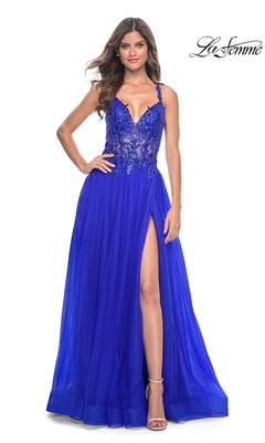 A woman wears the La Femme Beaded-Bodice Long A-Line Prom Gown 31471 in royal blue, featuring a lace bodice with thin straps, a high slit, and a floor-length tulle skirt. The La Femme logo appears in the upper right corner.