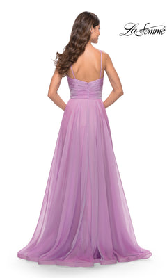 A woman with long brown hair is seen from the back, wearing the La Femme V-Neck Long A-Line Prom Dress 31500, which features a floor-length lavender chiffon design with thin straps and a ruched bodice.