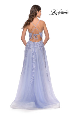 A woman in the La Femme Strappy-Back Long A-Line Prom Dress 31503, featuring light purple floral lace and a crisscross strappy-back, stands facing away.