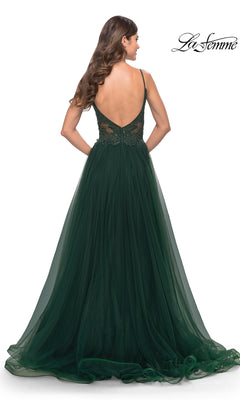 Woman wearing the Lace-Bodice Long Tulle Prom Dress: La Femme 31507 in dark green, featuring sheer lace detailing on the back, stands against a white background.