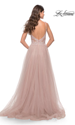 Woman wearing the Lace-Bodice Long Tulle Prom Dress: La Femme 31507 in blush pink, featuring a low back, lace bodice, thin straps, and an a-line tulle skirt as she stands gracefully with her back to the camera.
