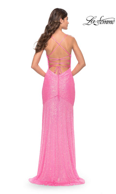 A woman stands facing away in a floor-length, pink sequin prom dress—La Femme 31509—with a strappy lace-up open back. The "La Femme" logo appears in the top right corner.