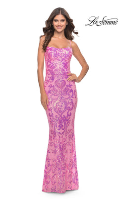 A woman in the Open-Back Long Sequin Prom Dress: La Femme 31521—fitted, floor-length, pink with intricate sequins and thin straps—stands smiling. The "La Femme" logo is shown in the top right corner.