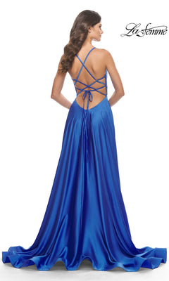 A woman stands with her back to the camera, wearing the La Femme 31533 Deep V-Neck Long A-Line Prom Dress in royal blue, featuring a crisscross open back and lace-up detailing.