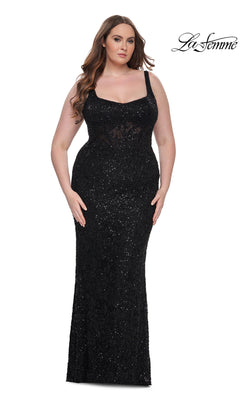 A woman models the Plus-Size Lace Prom Dress: La Femme 31535, a fitted black formal gown with wide straps, against a white background. The La Femme logo is in the top right corner.