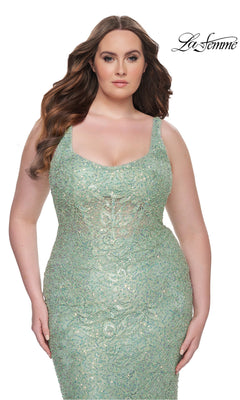 A woman wears the Plus-Size Lace Prom Dress: La Femme 31535 in light green, posing against a white background with the "La Femme" logo in the top right corner.