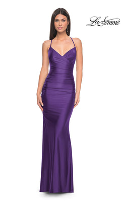 A woman stands against a plain white background wearing the La Femme Strappy-Back Simple Long Prom Dress 31618, a floor-length, fitted, sleeveless purple gown with spaghetti straps. "La Femme" logo appears in the upper right corner.