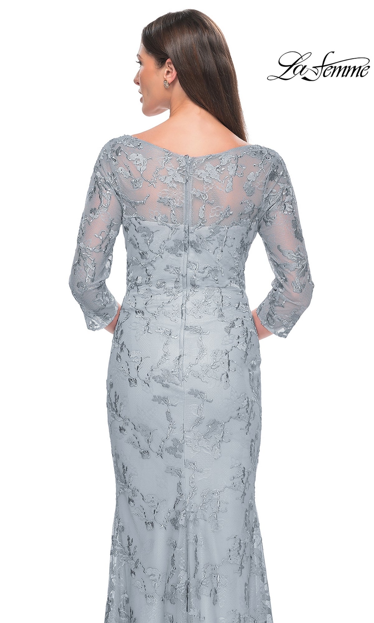 A woman is seen from the back wearing the La Femme Embroidered Lace Pastel Formal Dress 31684, featuring long sheer sleeves, floral lace embroidery, a zipper closure, and delicate see-through detailing; La Femme logo appears at the top right.