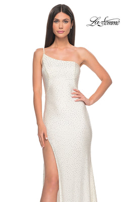 Woman wearing the La Femme Beaded One-Shoulder Long Prom Dress 31699, featuring rhinestone embellishments and a thigh-high slit, standing against a plain white background.