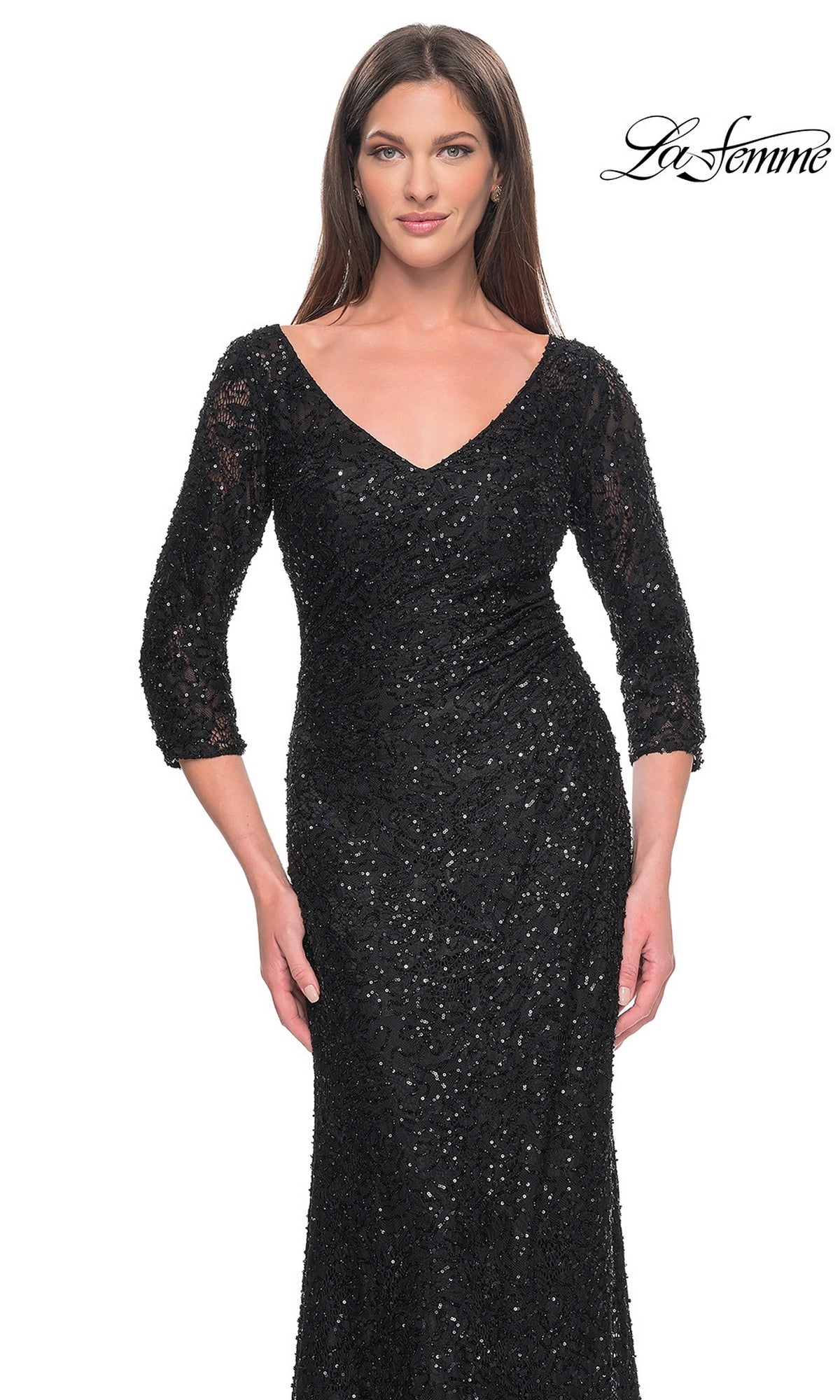 A woman wears a black, v-neck, three-quarter sleeve lace formal dress with sequin detailing, the La Femme 31721.