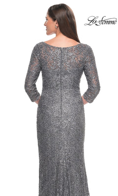 Back view of a woman wearing a La Femme 31721 floor-length, gray, sequined lace formal dress with three-quarter sleeves and a boat neckline.
