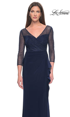 La Femme 31777 is a navy blue, floor-length modest formal dress with a V-neckline, sheer three-quarter sleeves, and a beaded bodice.