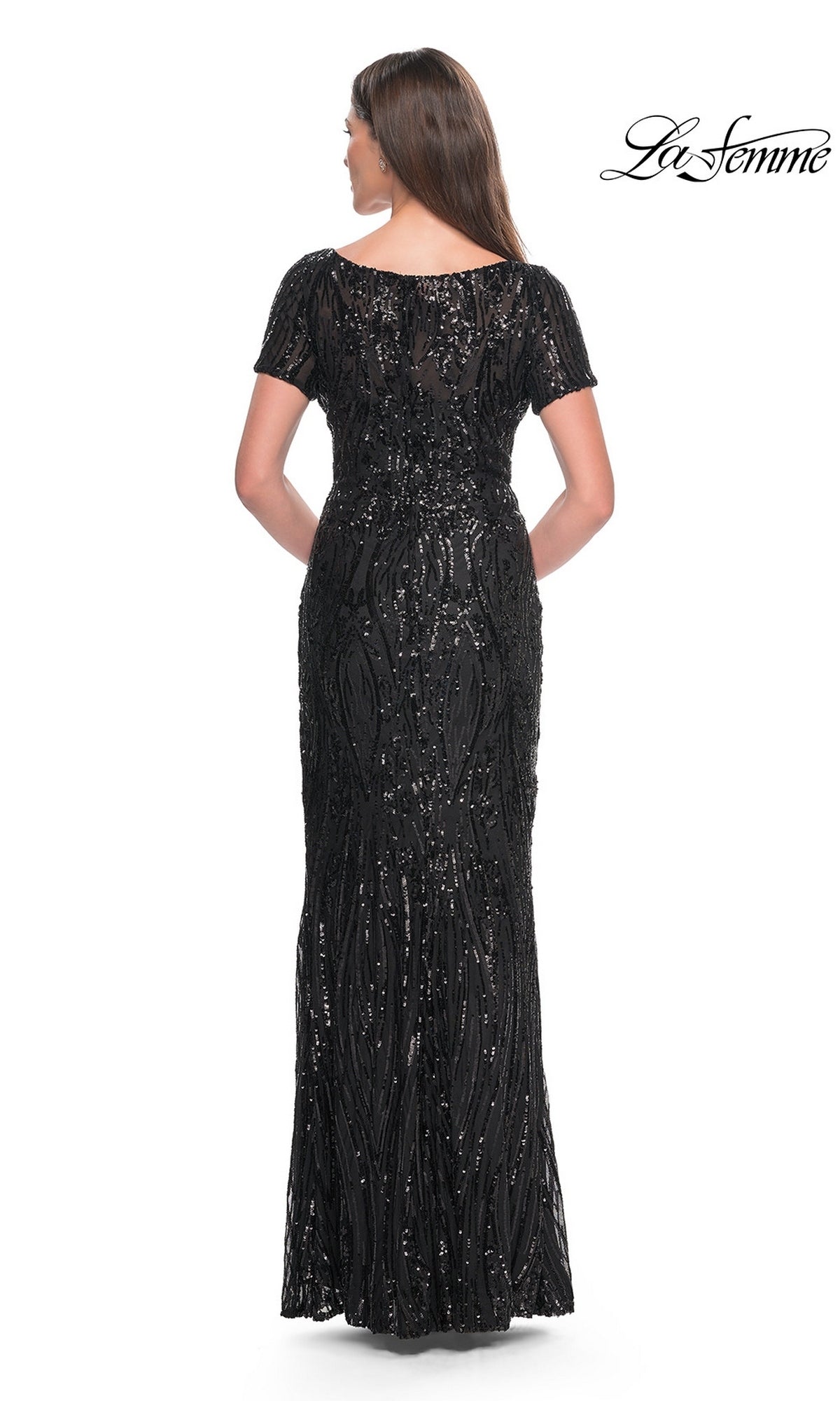 Back view of a woman in a Long Formal Dress: La Femme 31852, a floor-length black sequined formal dress with short sleeves and a scoop neckline.