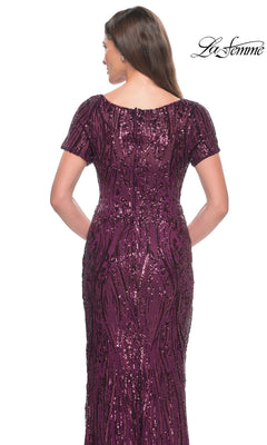 Back view of a floor-length, short-sleeved purple Long Formal Dress: La Femme 31852 featuring an all-over sequined pattern.