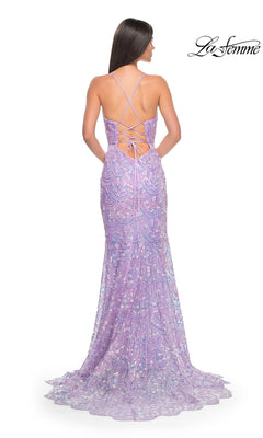 A woman faces away in the La Femme Sequin-Print Long Prom Dress 31865, featuring lilac sequins, a lace-up open back with thin crisscross straps, and a gently flared, elegant floor-length silhouette.