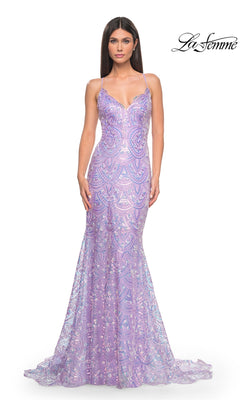 A woman wears the La Femme Sequin-Print Long Prom Dress 31865, a fitted, floor-length lavender gown with thin straps and a subtle geometric sequin pattern, standing against a white background.