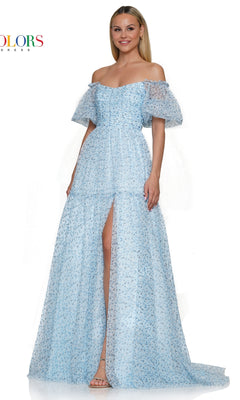 A woman wearing the Colors Dress Long A-Line Prom Dress 3190, featuring light blue fabric, puff sleeves, an off-the-shoulder neckline, fitted bodice, high slit, and a subtle floral pattern.