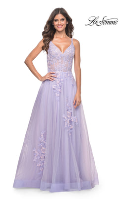 A woman wears the La Femme Embroidered-Lace Long Prom Dress 31939, a lavender floor-length gown with floral details, sheer bodice, and spaghetti straps, standing against a white background. "La Femme" is displayed in the top right corner.