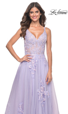 A woman stands smiling against a white background, wearing the La Femme Embroidered-Lace Long Prom Dress 31939 in light purple with a sleeveless V-neck, sheer bodice, and floral lace details.