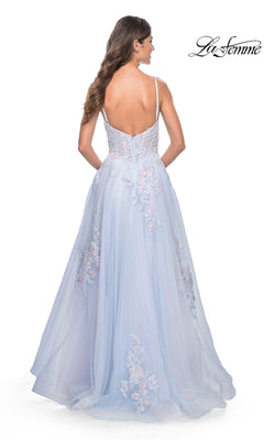 A woman with long hair, seen from behind, models the La Femme Embroidered-Lace Long Prom Dress 31939 in light blue, featuring a floor-length skirt, thin straps, embroidered floral lace accents, and a low back.