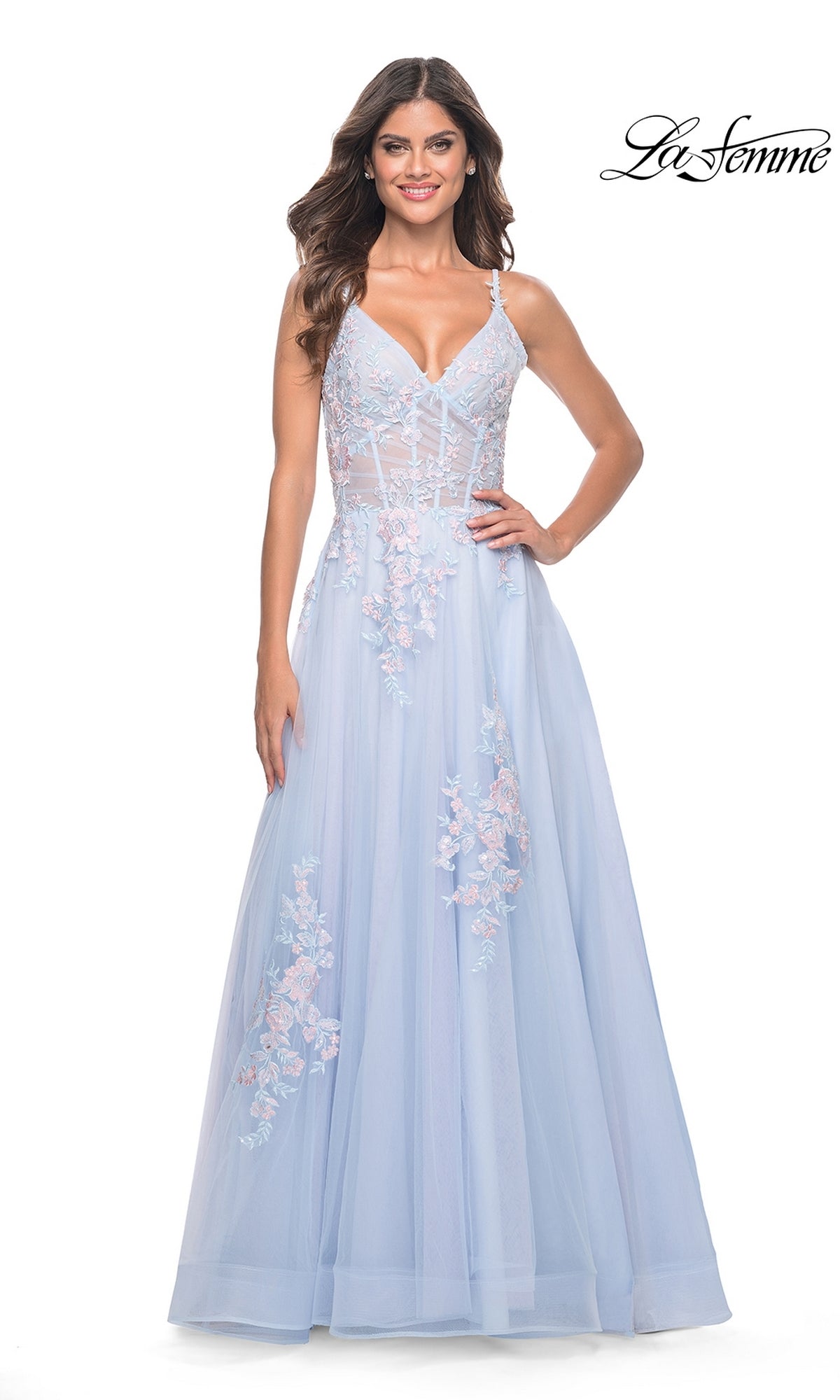 A woman poses against a white background wearing the La Femme Embroidered-Lace Long Prom Dress 31939, featuring a light blue hue, thin straps, embroidered floral lace details, and a semi-sheer bodice.