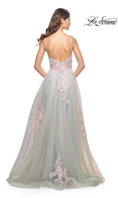 A woman stands facing away in the La Femme Embroidered-Lace Long Prom Dress 31939, featuring light green tulle with pink floral appliqués, spaghetti straps, a low back, and embroidered-lace details. "La Femme" logo appears in the top right corner.