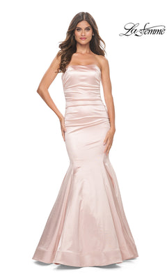 A woman faces forward against a white background, wearing the La Femme Strapless Long Mermaid Prom Dress 31980 in light pink. "La Femme" appears in the top right corner, accentuating this elegant designer gown.