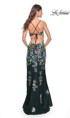 Woman wearing the La Femme Floral-Sequin Long Prom Dress 31992, a black floor-length gown with colorful floral embroidery and crisscross open-back straps—perfect for making a statement at any special occasion.