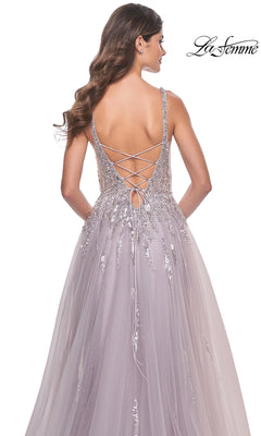 A woman in the Sequined Long Mauve Prom Dress: La Femme 31995, featuring an A-line silhouette and lace-up open back, stands against a white background.