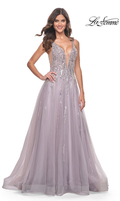 A woman in the Sequined Long Mauve Prom Dress: La Femme 31995, featuring a deep V neckline, sequin details, and a flowing tulle skirt, stands against a white background.