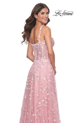 A woman smiles while posing with her back turned in the La Femme Floral-Embellished Long Prom Dress 31996; the "La Femme" logo is displayed in the top right corner.