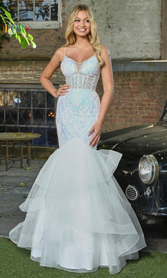 A woman stands outdoors beside a vintage black car, wearing the Sequin-Print Long Mermaid Prom Dress 3200 with a corset-style bodice and layered tulle skirt in light blue and white mermaid styling.