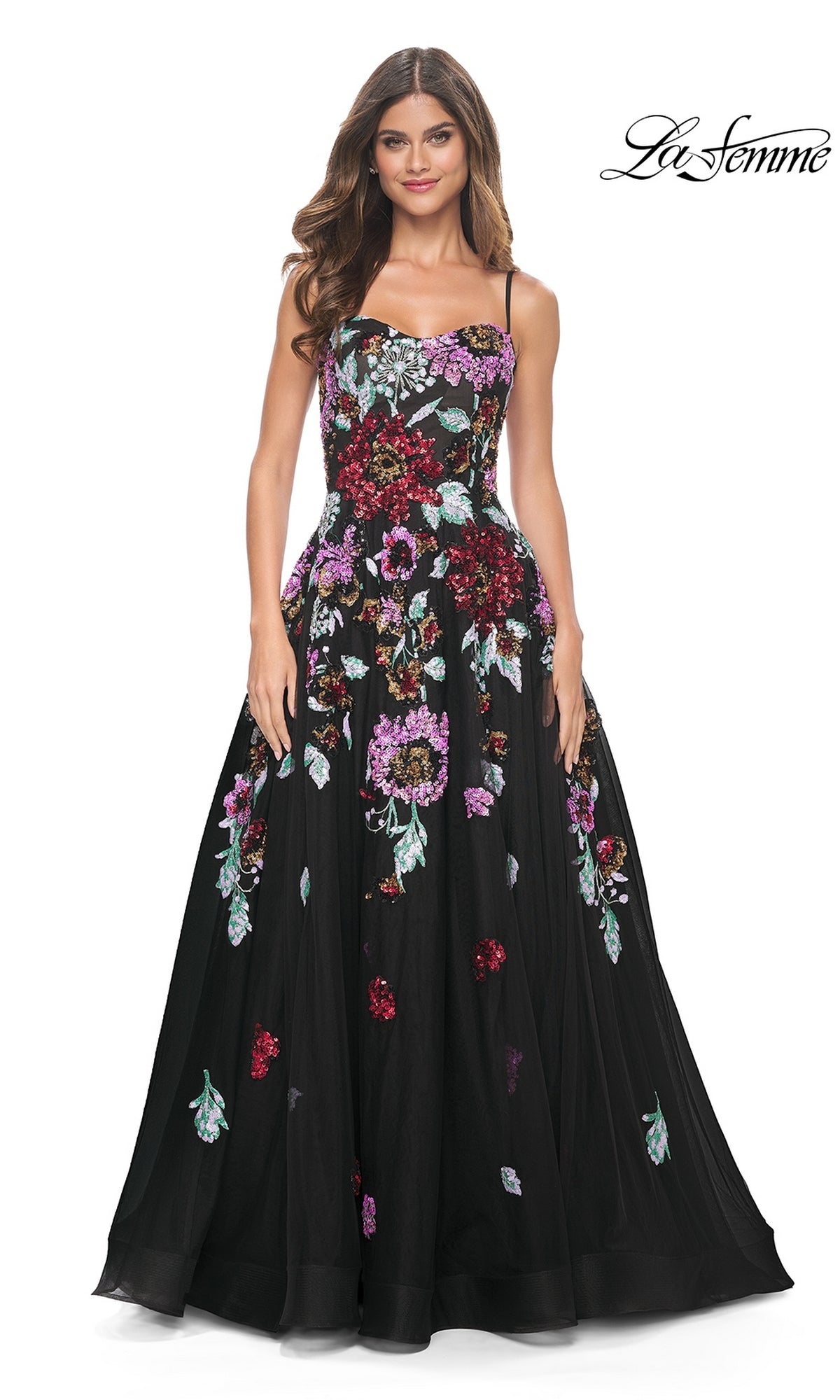Woman wearing the La Femme Sequin-Floral Long Prom Dress 32019, featuring a long black A-line silhouette, colorful sequin floral embroidery, thin straps, and a fitted bodice. 