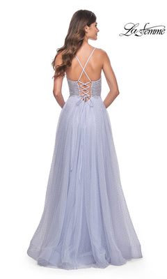 A woman is shown from behind wearing the La Femme Beaded Long A-Line Prom Dress 32020, featuring a light purple hue, long formal silhouette, thin criss-cross straps, and a lace-up back detail.