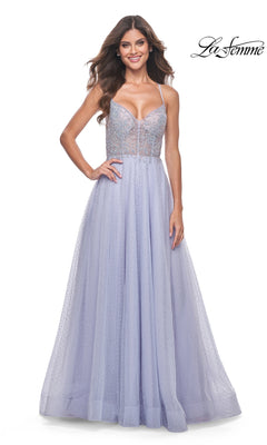 A woman smiles against a white background wearing the La Femme Beaded Long A-Line Prom Dress 32020 in light purple, featuring a fitted bodice with thin straps and a full tulle skirt.
