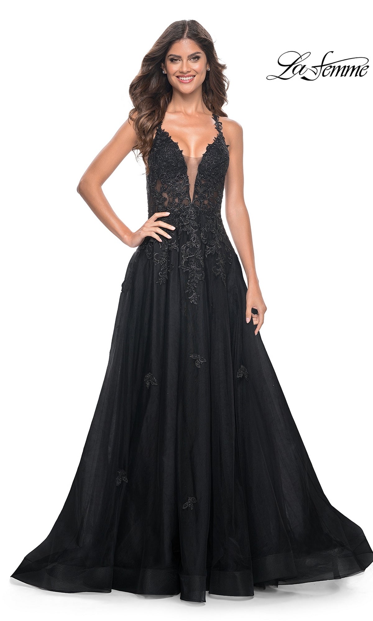 A woman stands gracefully in the La Femme Embroidered-Lace Long Prom Gown 32022, her look elevated by the elegant silhouette and stunning black embroidered lace design.