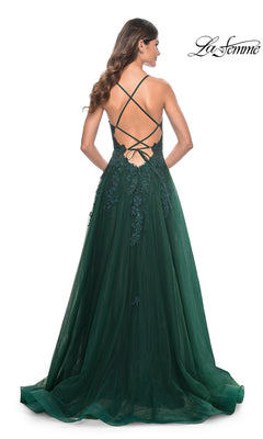 A woman shown from behind wears the La Femme Embroidered-Lace Long Prom Gown 32022, a floor-length dark green dress with floral lace accents and an open back with crisscross straps.