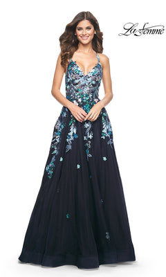 Woman in a floor-length, sleeveless navy La Femme Sequin Flower-Print Long Prom Dress 32023 with blue and green floral embroidery, smiling. "La Femme" logo appears in the top right corner.