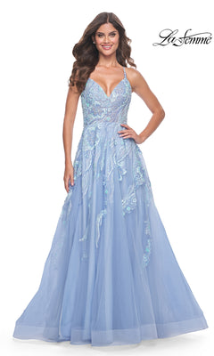 A woman wears the La Femme Sequin-Lace Long A-Line Prom Dress 32032 in light blue, featuring sequin and lace details. She stands and smiles against a white background with the La Femme logo in the top right corner.