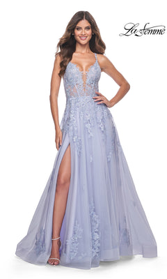 A woman wears the La Femme Embroidered-Lace Long Prom Dress 32062 in light purple, featuring embroidered lace, a deep V-neckline, sheer bodice, and thigh-high slit.