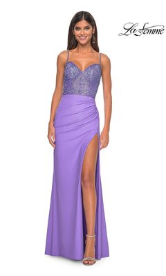 A woman in the La Femme Beaded-Corset Long Prom Dress 32089—a lavender gown with a beaded bodice, spaghetti straps, and high-slit skirt—stands smiling, showcasing this stunning choice for any formal event.