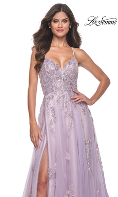 A woman poses with one hand on her hip wearing the La Femme Sequin-Embroidered Long Prom Dress 32090—lavender, embellished with sequins, thin straps, and a high slit. La Femme logo appears in the top right corner.