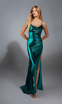 A woman models the Aerie Couture 320 long prom dress in metallic green, featuring a corset lace-up back and thigh-high slit, standing before a plain gray background.