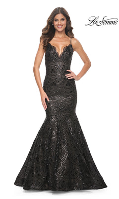 A woman modeling the La Femme Black Sequin-Print Long Prom Dress 32118—a floor-length mermaid gown with spaghetti straps, a scalloped neckline, and sparkling black sequins.