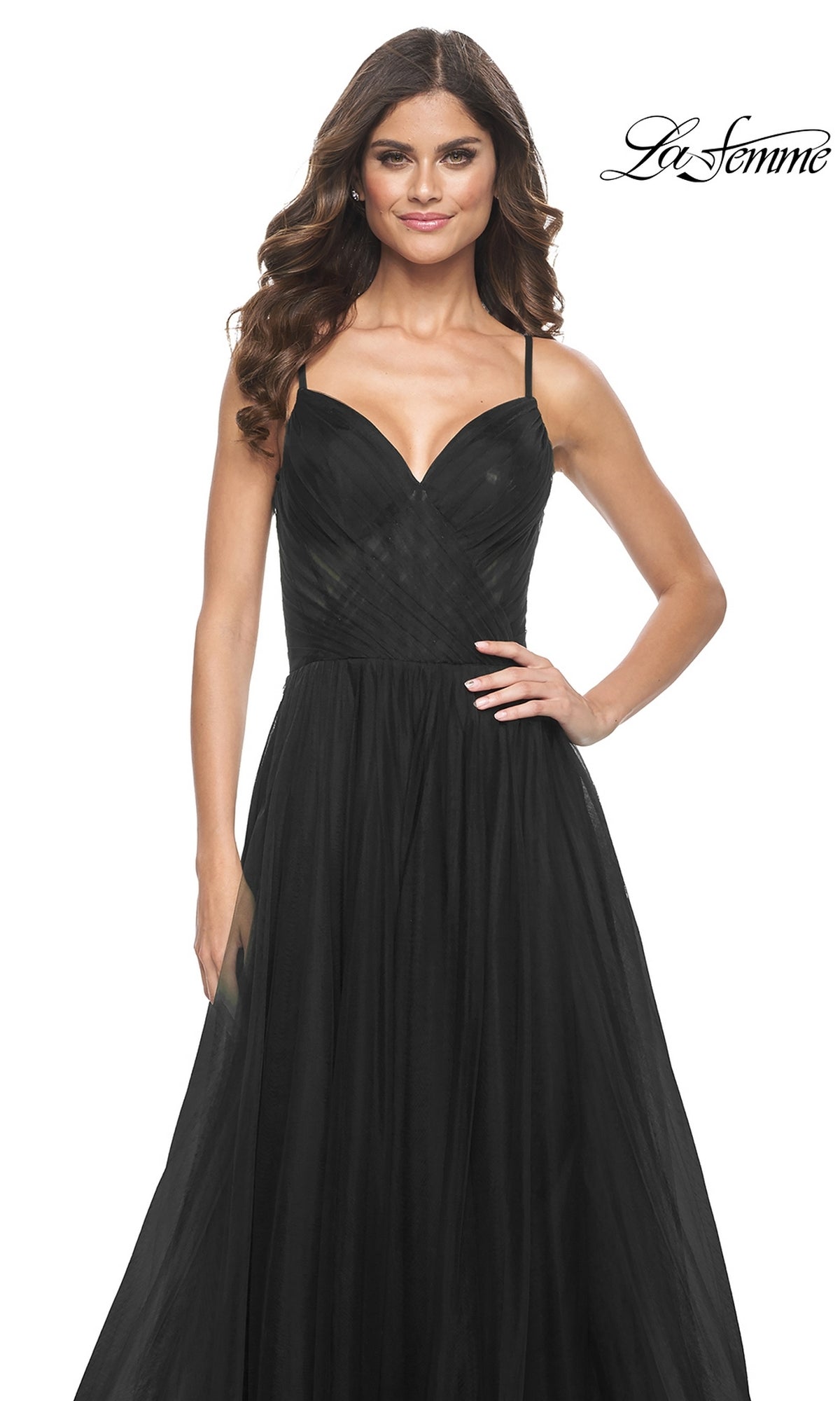 A woman models the La Femme Sheer-Waist Long A-Line Prom Dress 32130, a sleeveless black formal dress with a sweetheart neckline and fitted bodice, standing against a white background with the La Femme logo in the top right corner.